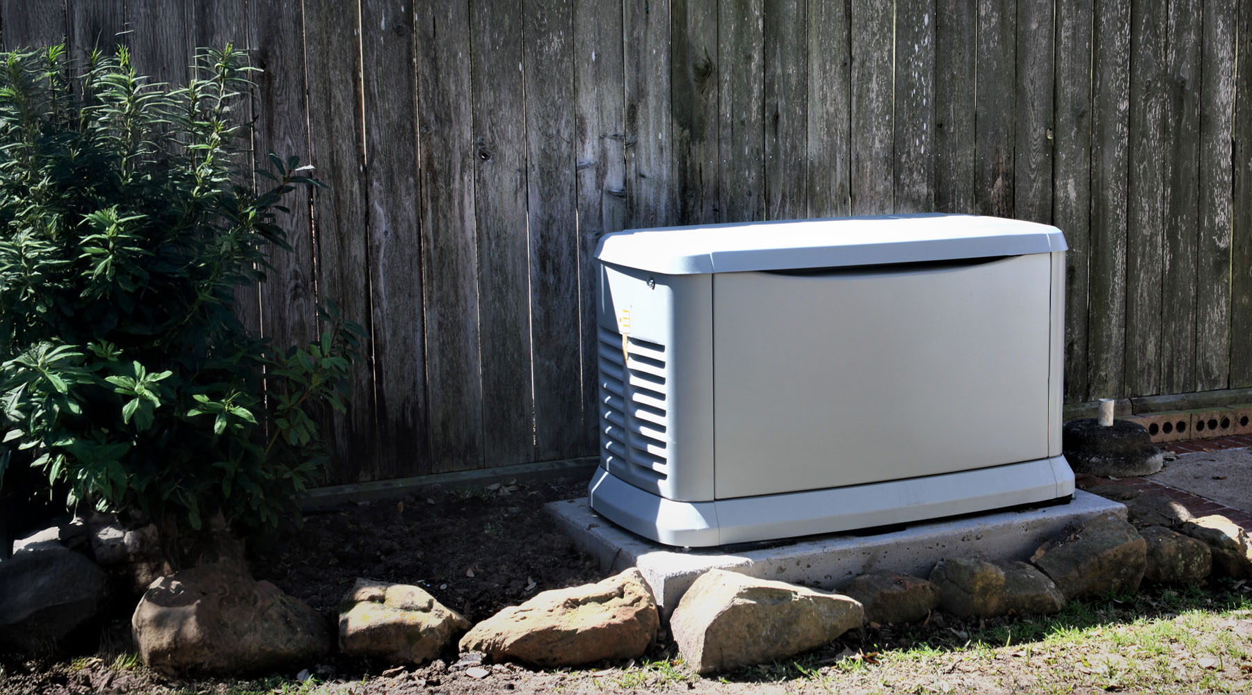 standby generator system inside backyard